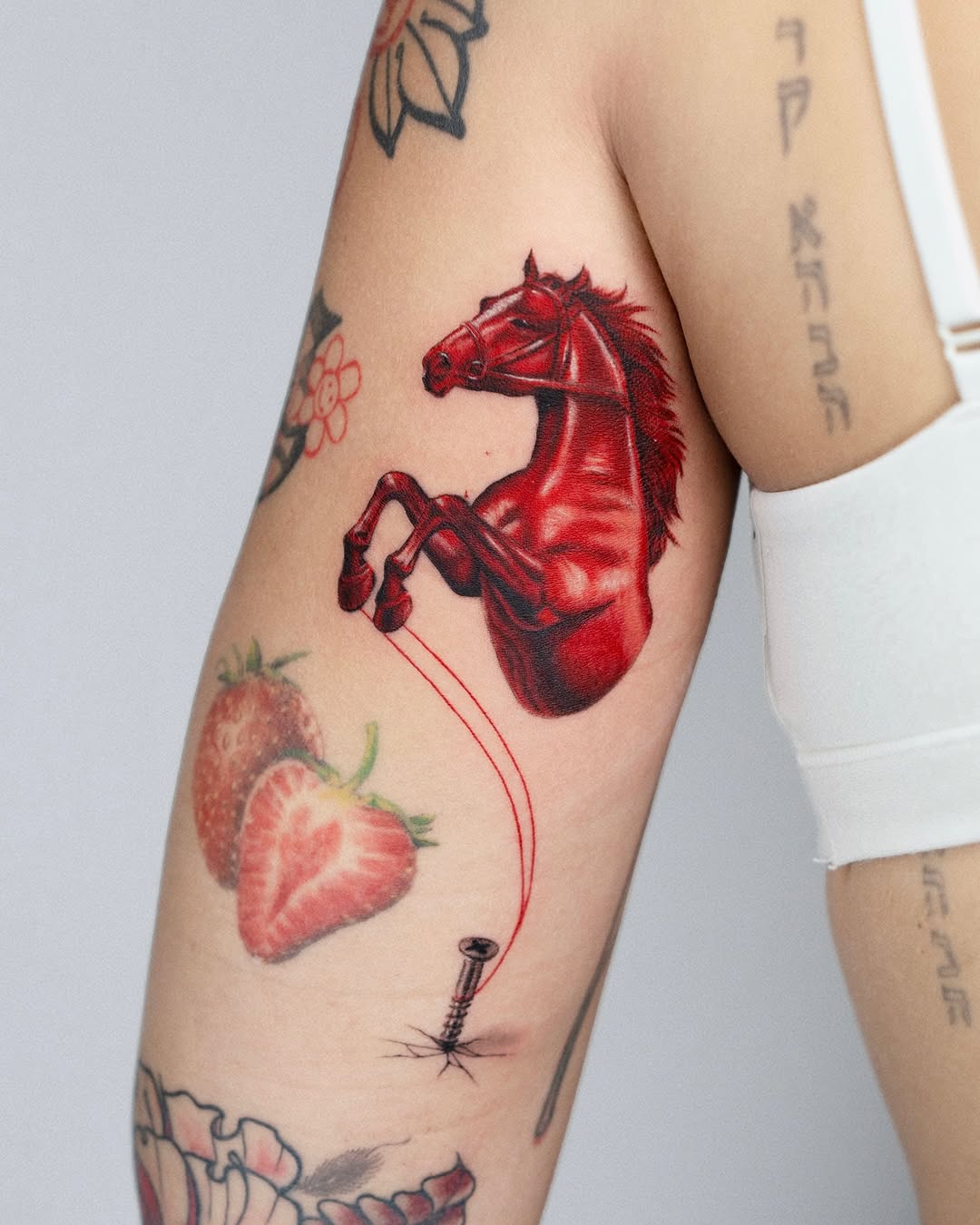 Dynamic red horse tattoo for bold expression