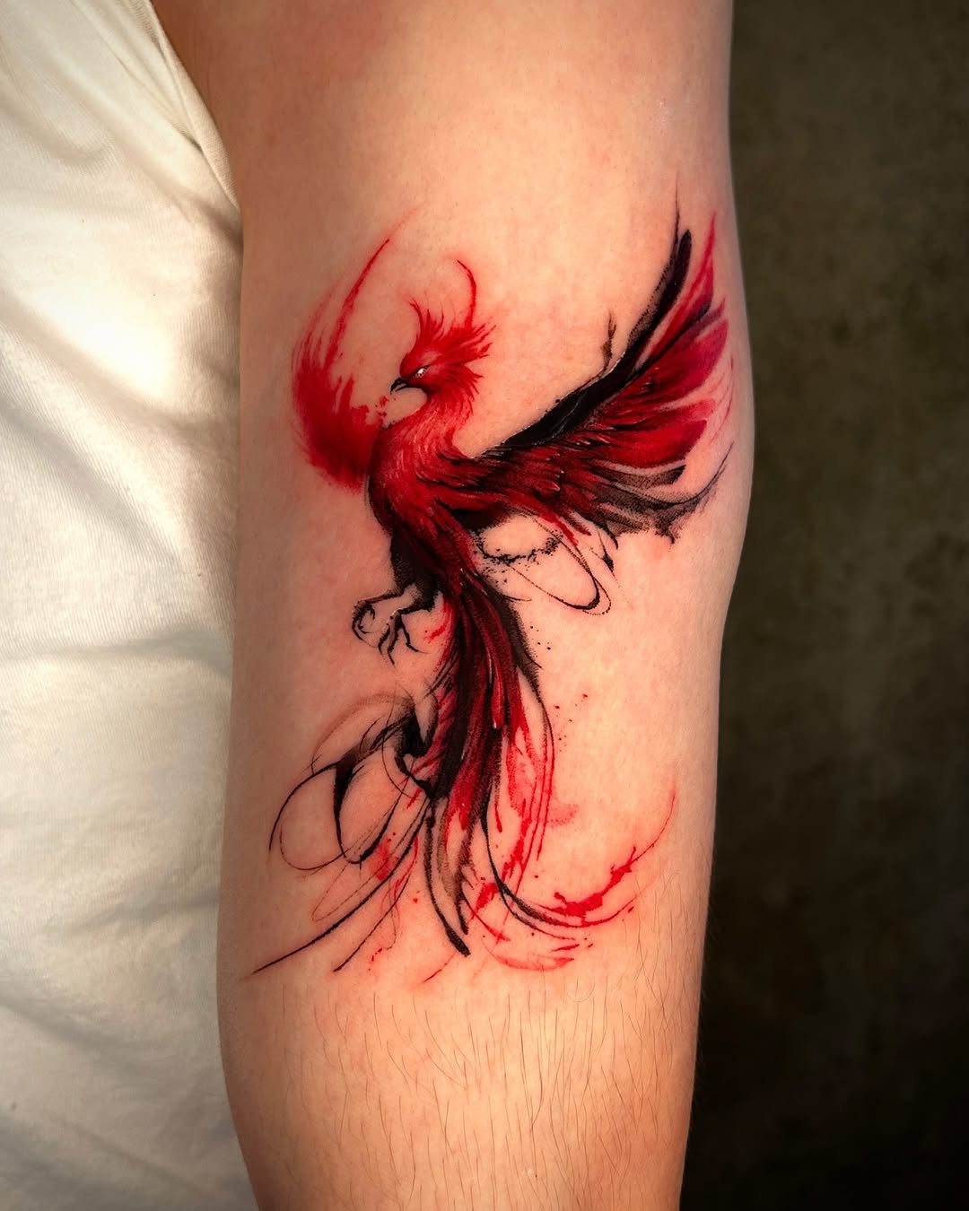 Striking phoenix tattoo in fiery hues