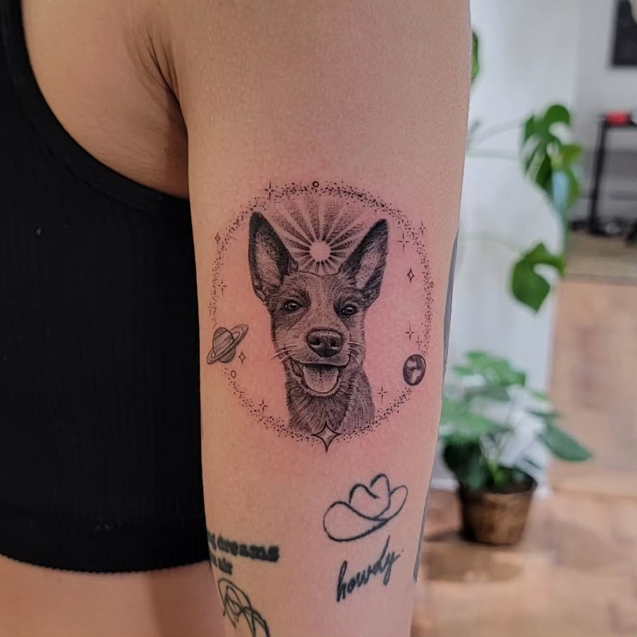 Stylish dog tattoo with celestial elements