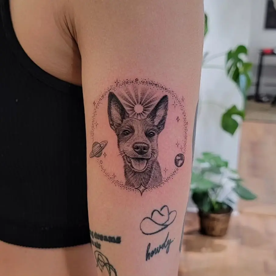 Stylish dog tattoo with celestial elements