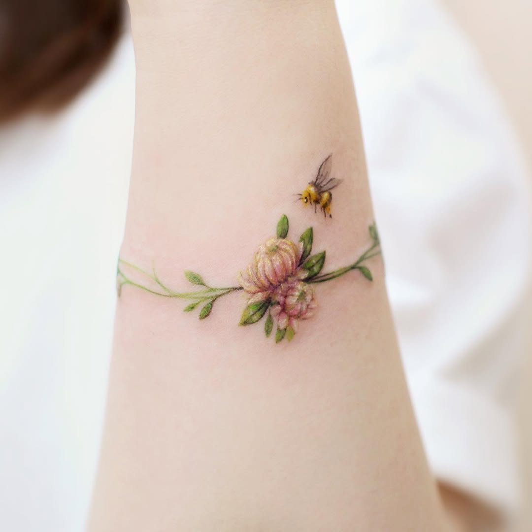 Stunning watercolor bee and floral tattoo design