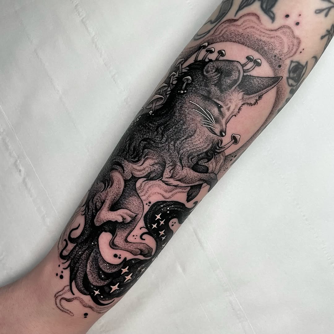 Whimsical fox tattoo with starry elements