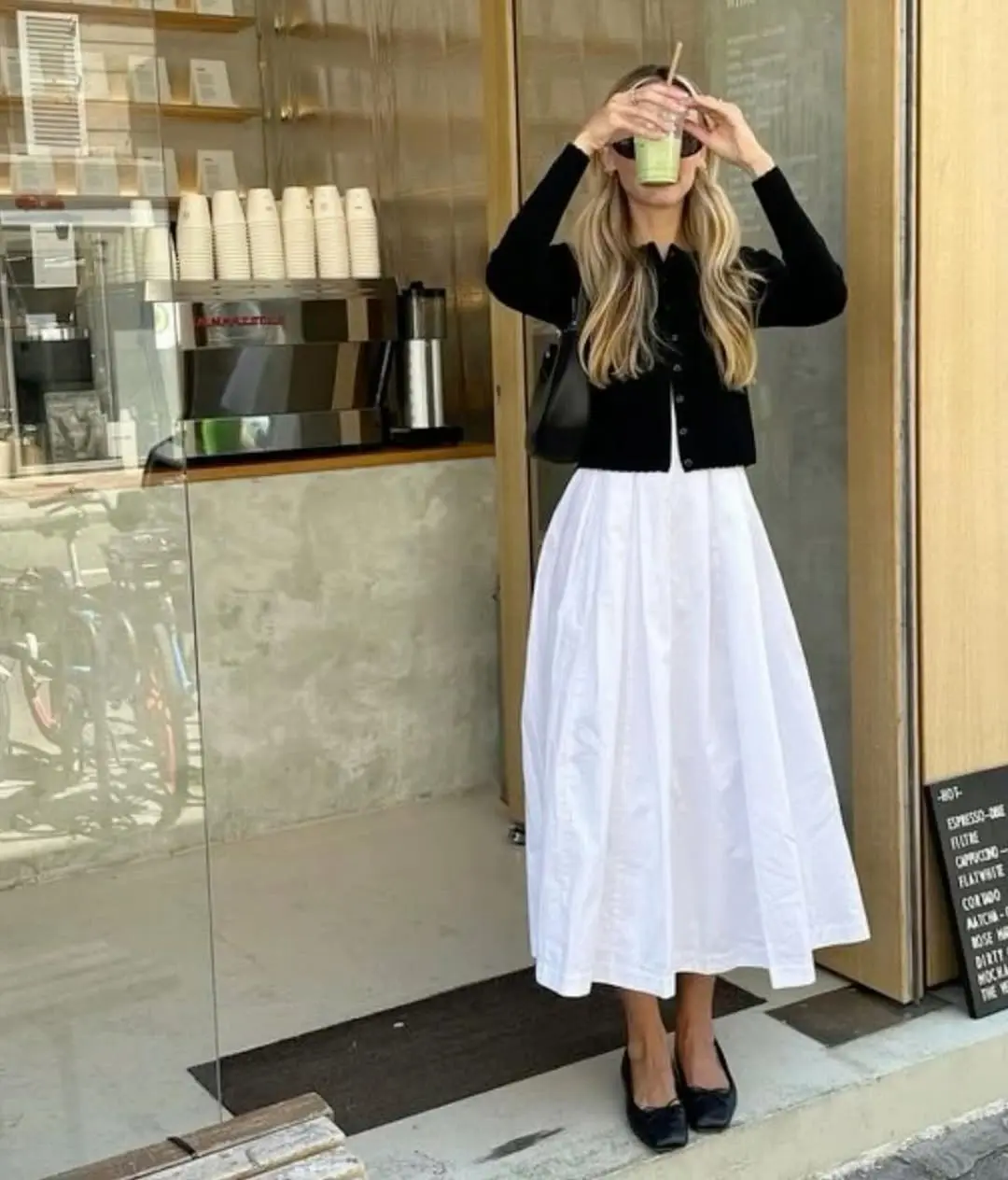 Chic White Skirt with Black Cardigan Ensemble
