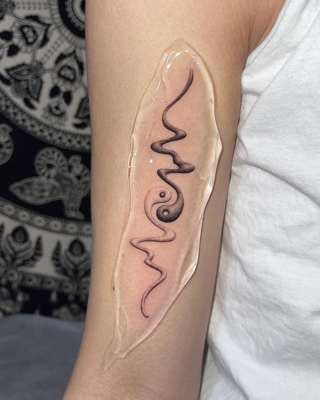 Sleek and modern yin yang snake tattoo design