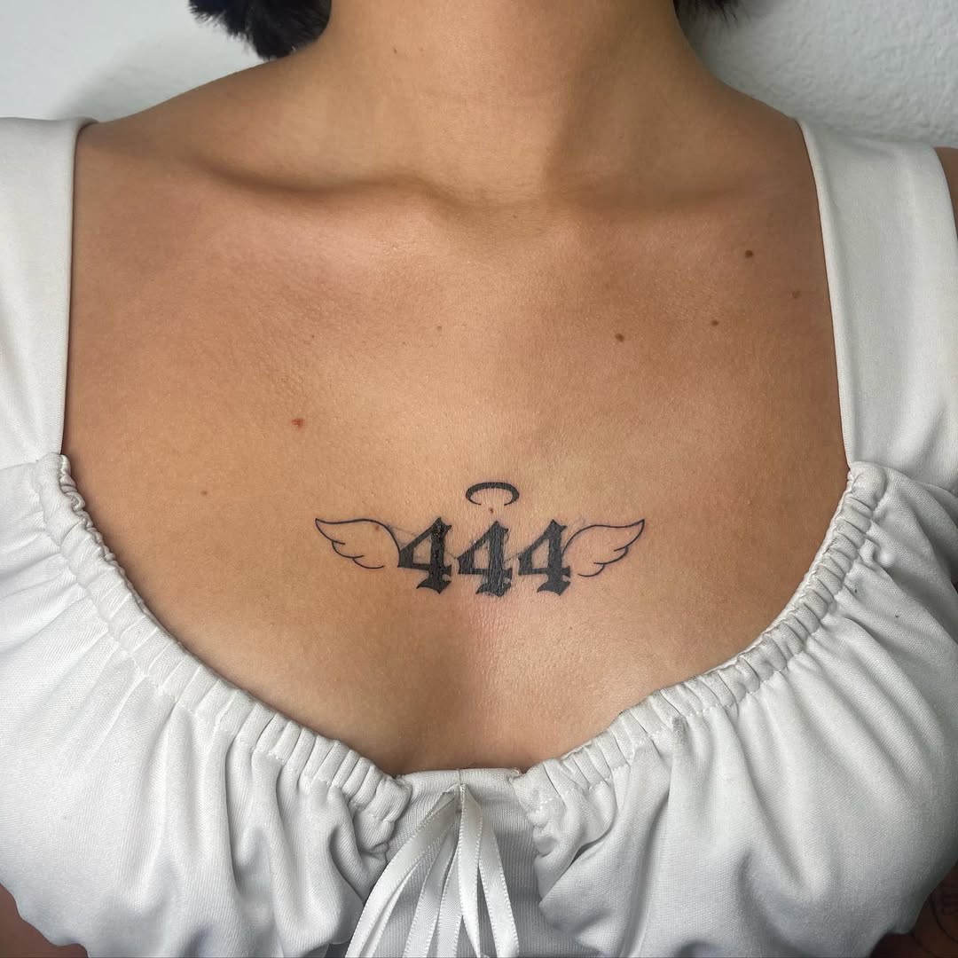 Elegant winged tattoo representing angel number 444