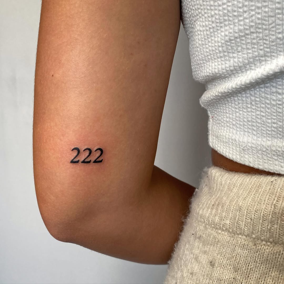 Minimalist tattoo featuring the number 222