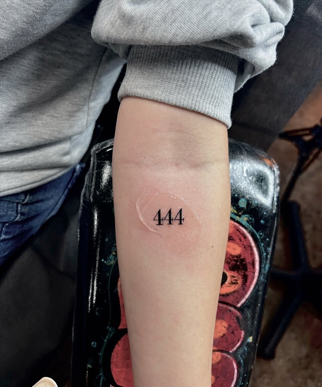 Stylish minimalism in angel number tattoos