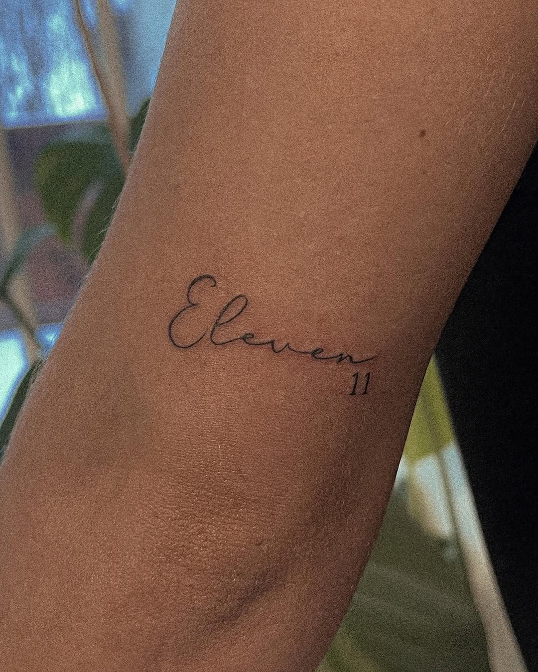 Elegant tattoo showcasing the number eleven