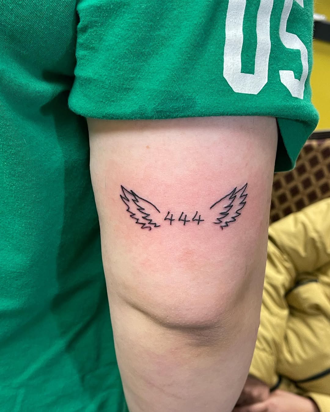 Stylish 444 angel number tattoo with wings