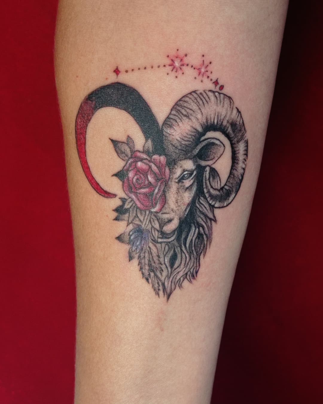 Stunning Aries tattoo with ram and rose