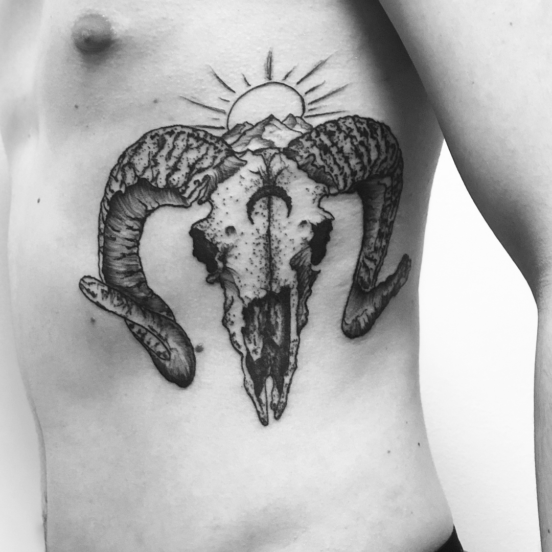 Stylish Aries Tattoo Featuring Ram Skull Design