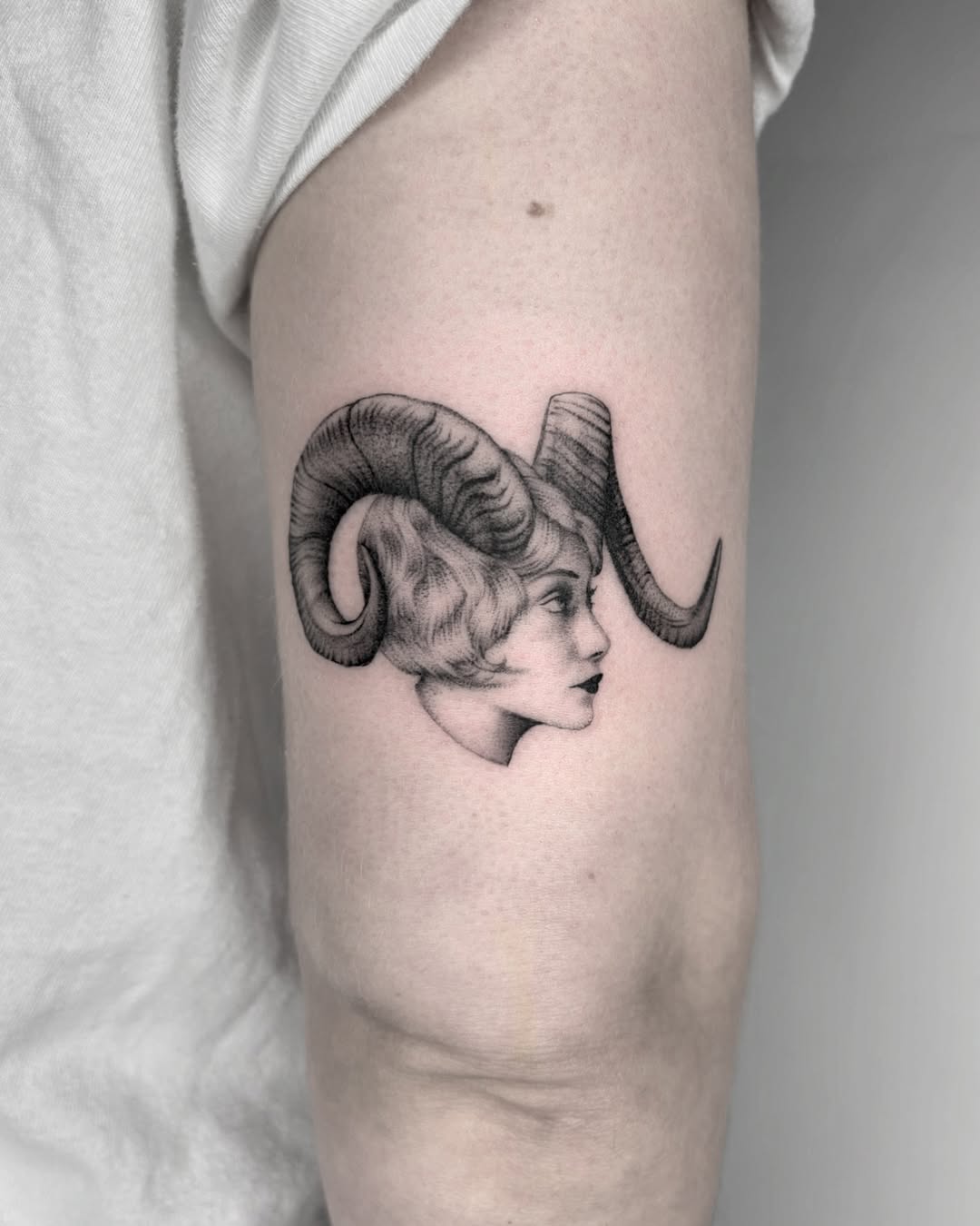 Elegant Aries Tattoo Featuring Horned Profile