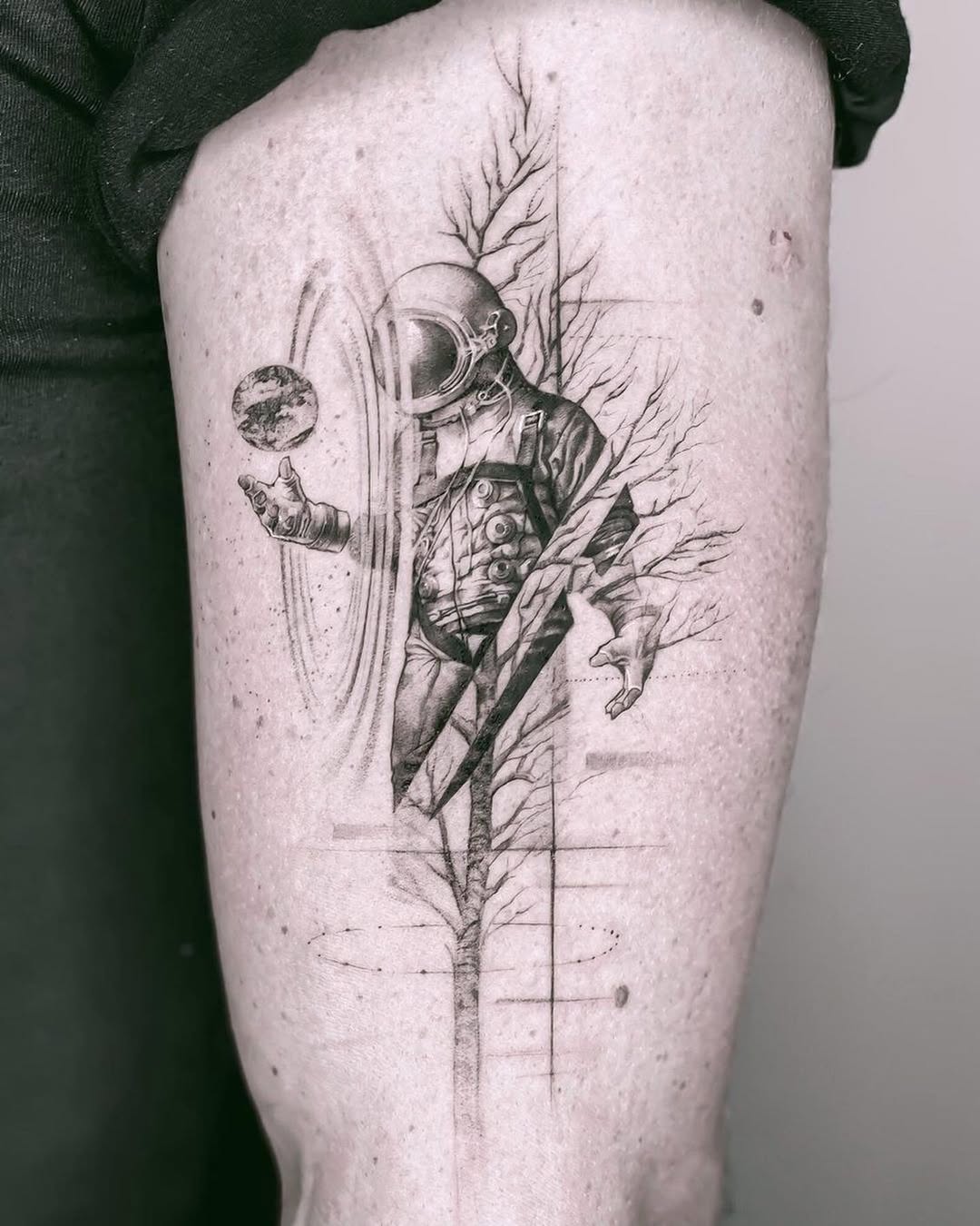 Stunning astronaut tattoo with nature elements