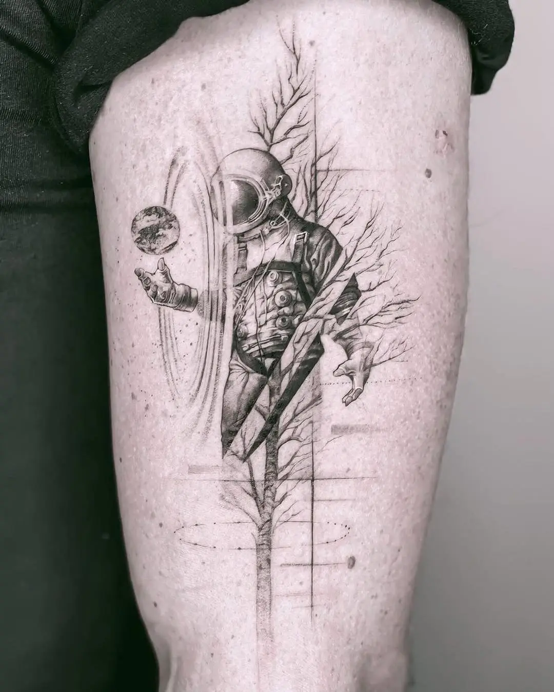 Stunning astronaut tattoo with nature elements
