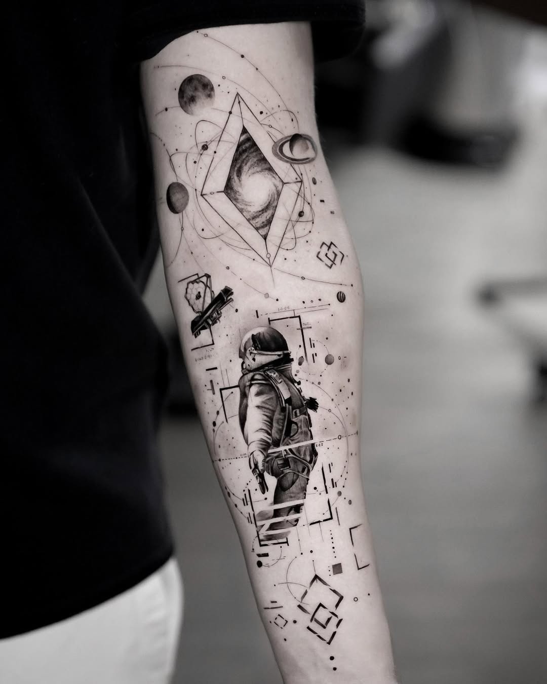 Stunning astronaut tattoo with cosmic elements