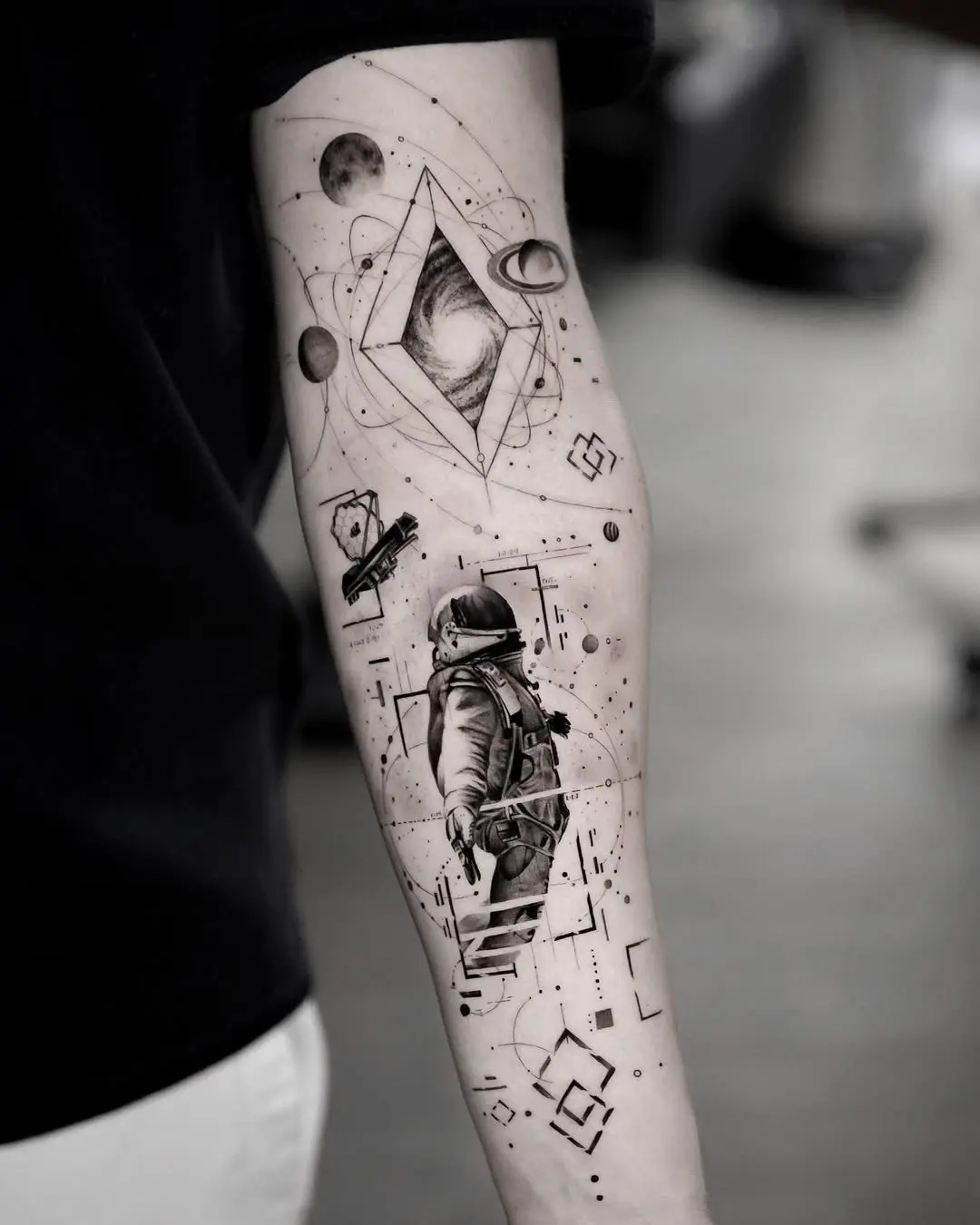 Stunning astronaut tattoo with cosmic elements
