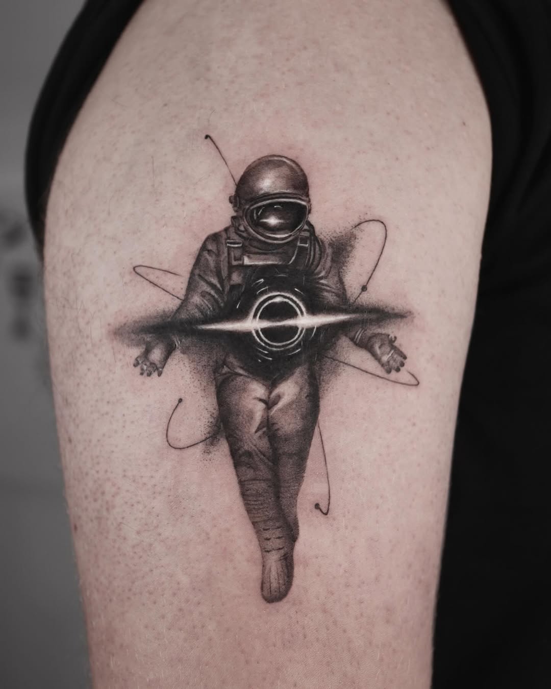 Intricate tattoo of a floating astronaut