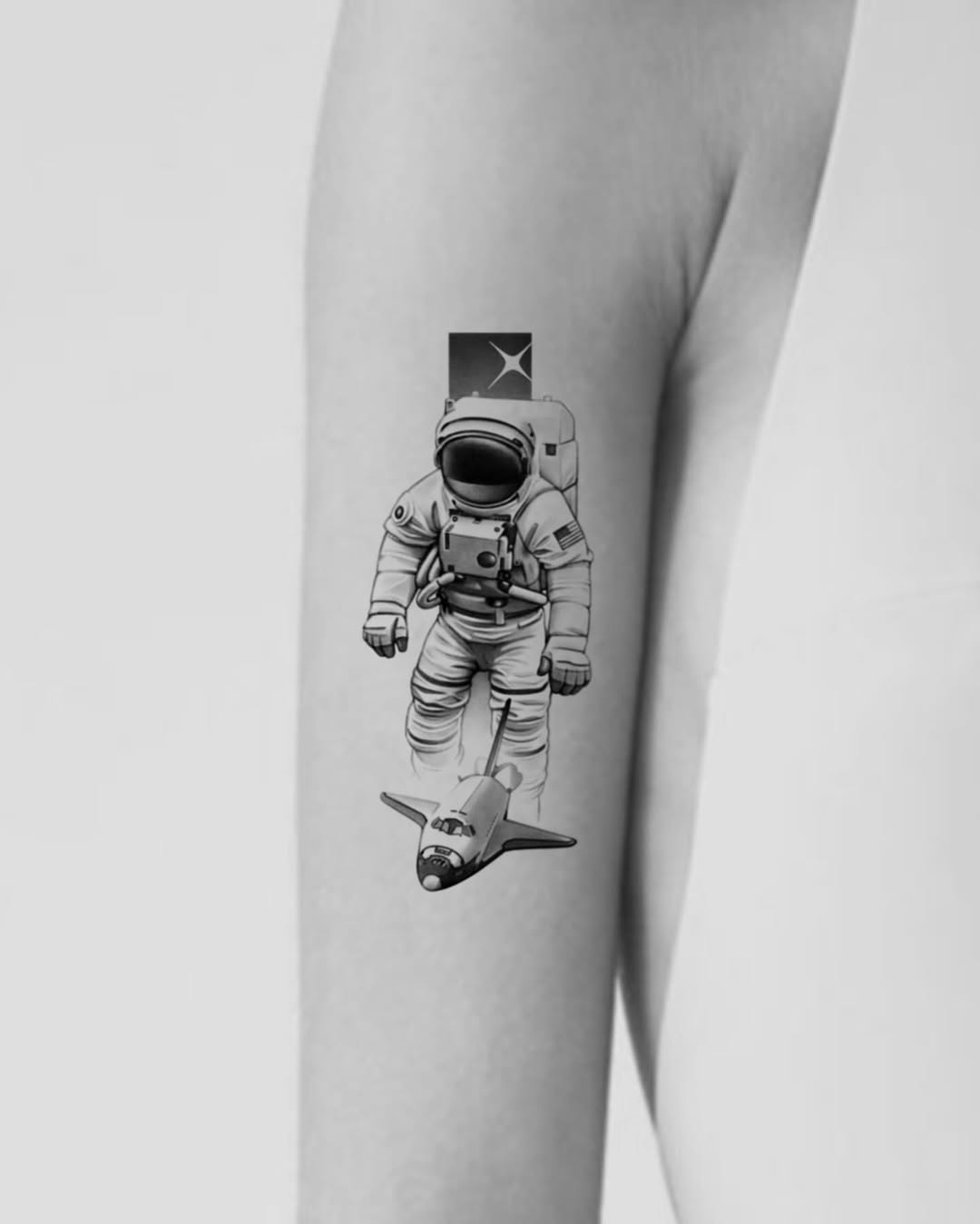 Unique astronaut tattoo with vintage rocket design