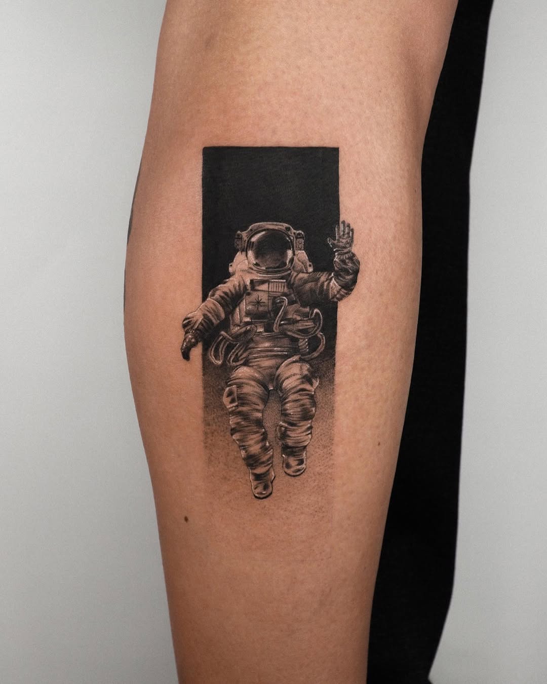 Stylish astronaut tattoo with a cosmic vibe