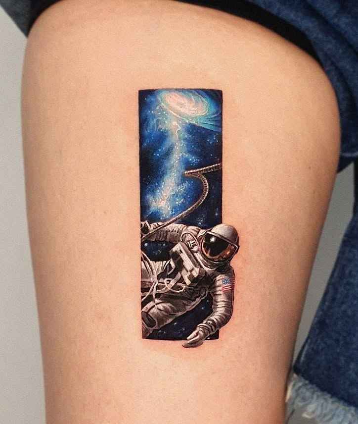 A stunning astronaut tattoo in deep space