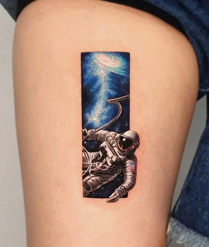 A stunning astronaut tattoo in deep space
