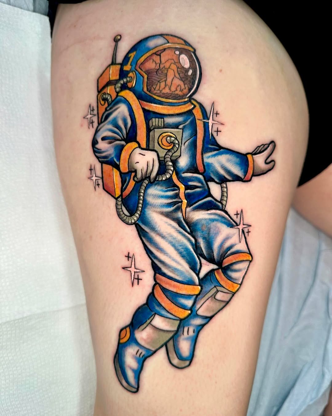 Vivid astronaut tattoo showcasing space vibes