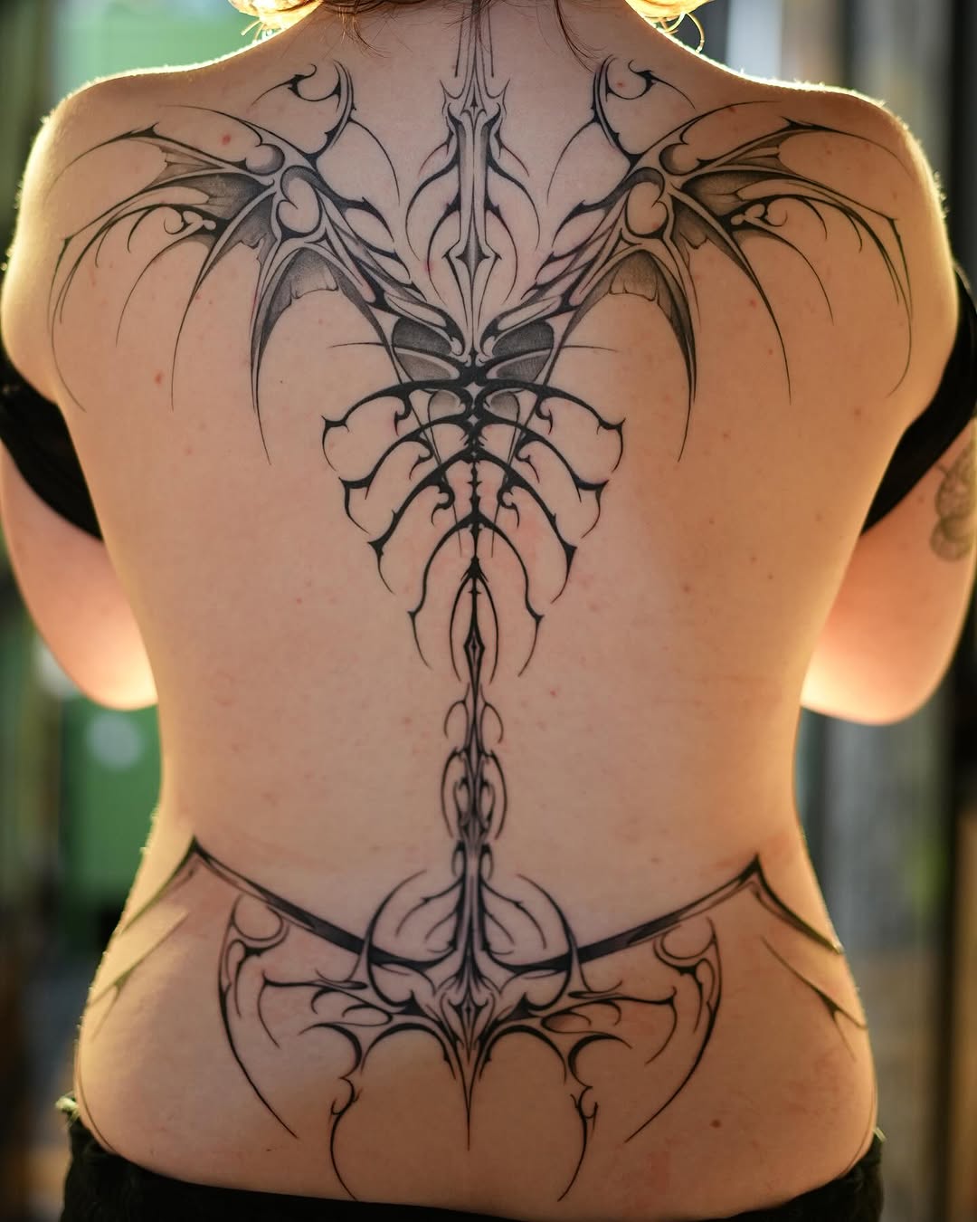 Stunning Intricate Back Tattoo for Women