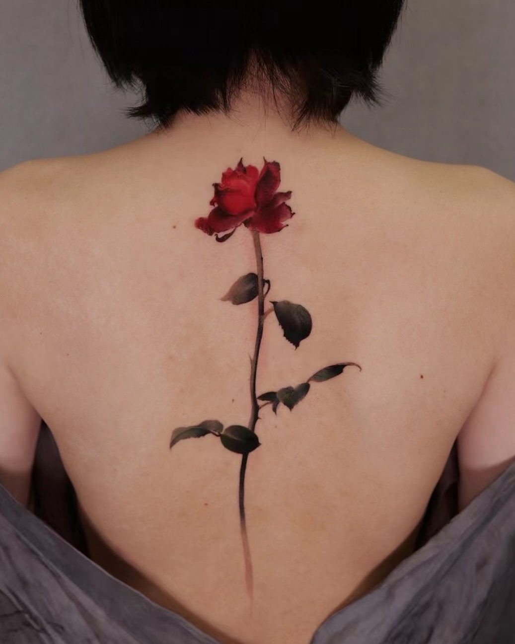 Elegant Red Rose Back Tattoo Design