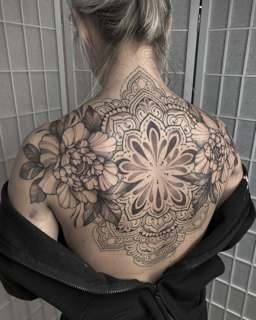 Intricate floral mandala back tattoo design