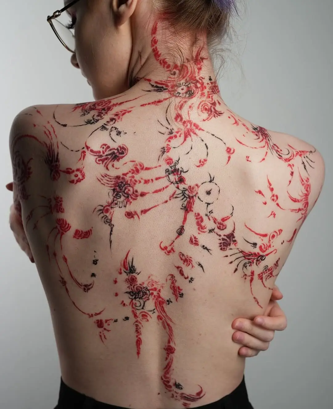 Intricate Floral Back Tattoo Design for Women