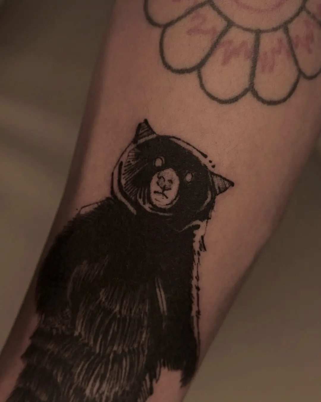Mysterious bear tattoo with a gothic flair