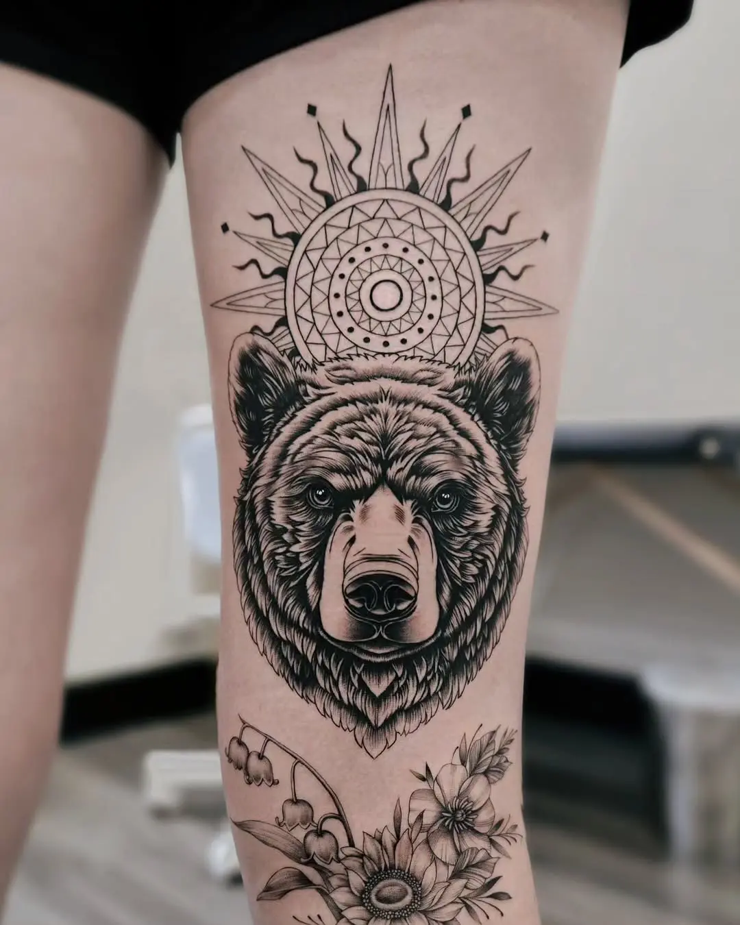 Stunning bear tattoo with mandala sun design