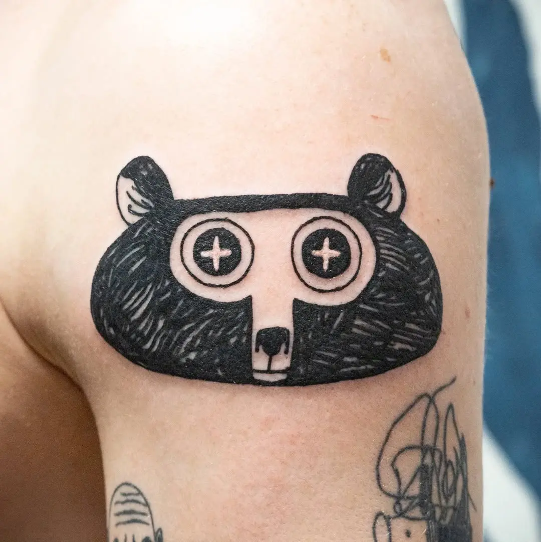 Quirky bear tattoo with playful eyes