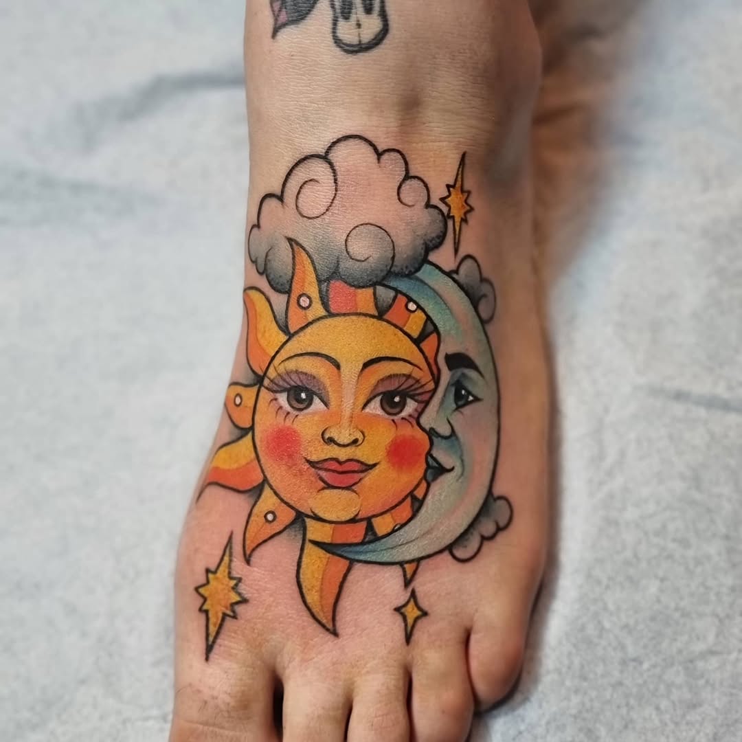 Vibrant sun and moon foot tattoo