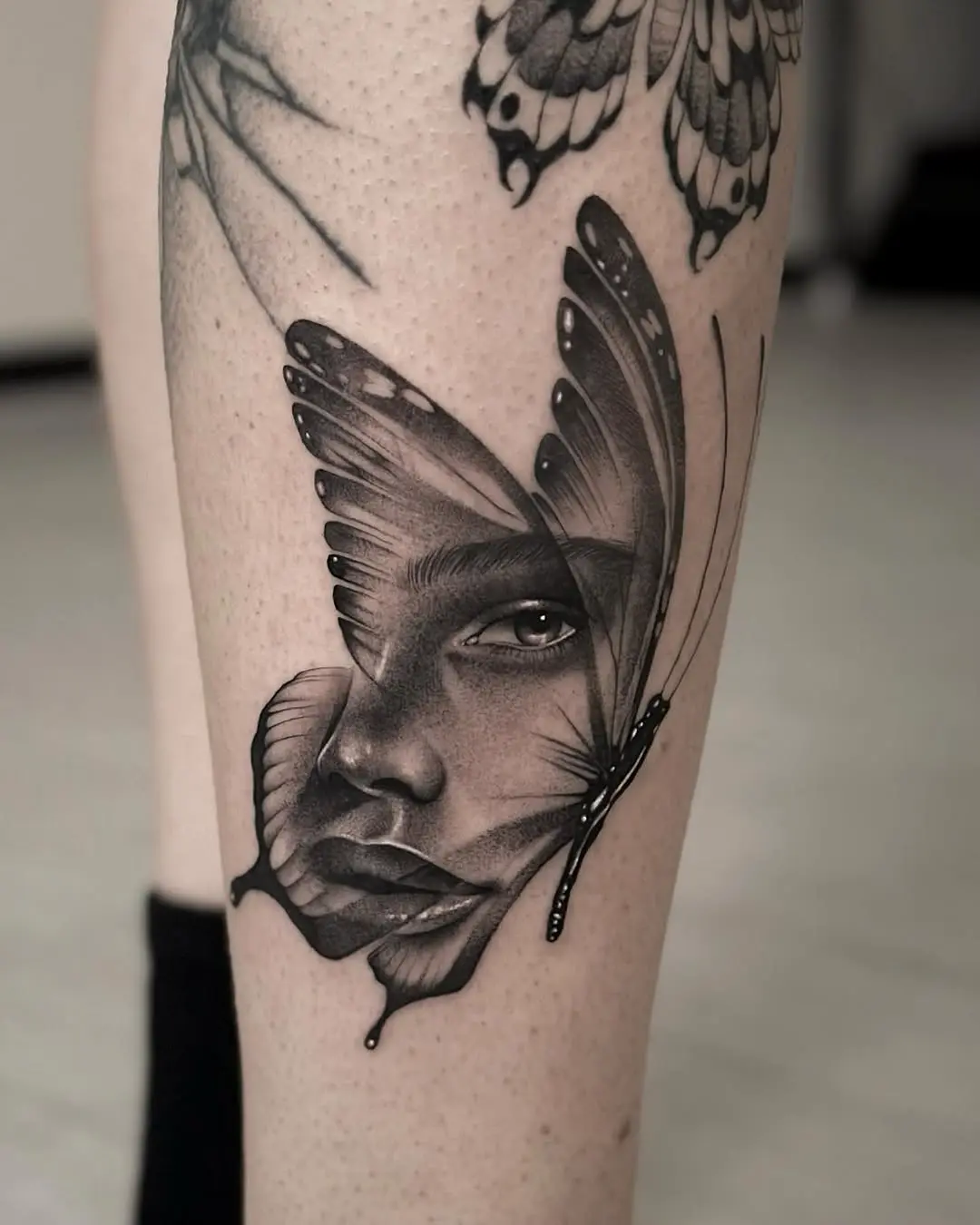 Unique butterfly face tattoo showcasing beauty and mystery