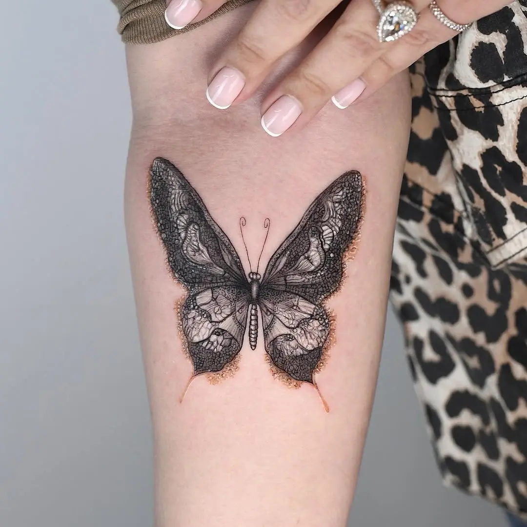 Intricate lace butterfly design on skin