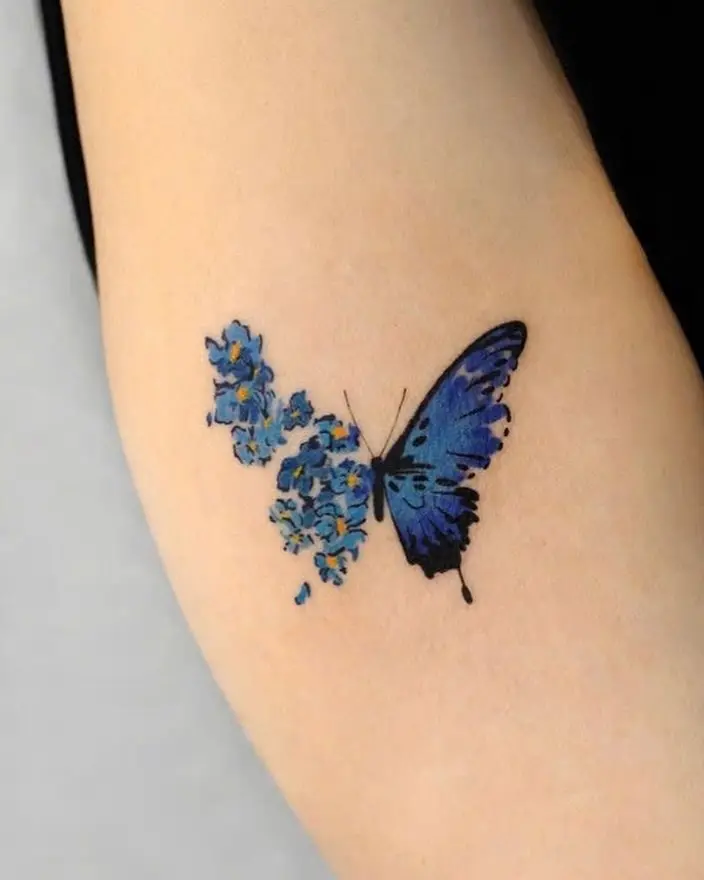 Stunning butterfly tattoo with floral accents