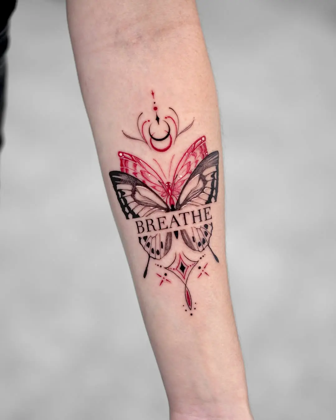 Elegant butterfly tattoo with motivational text