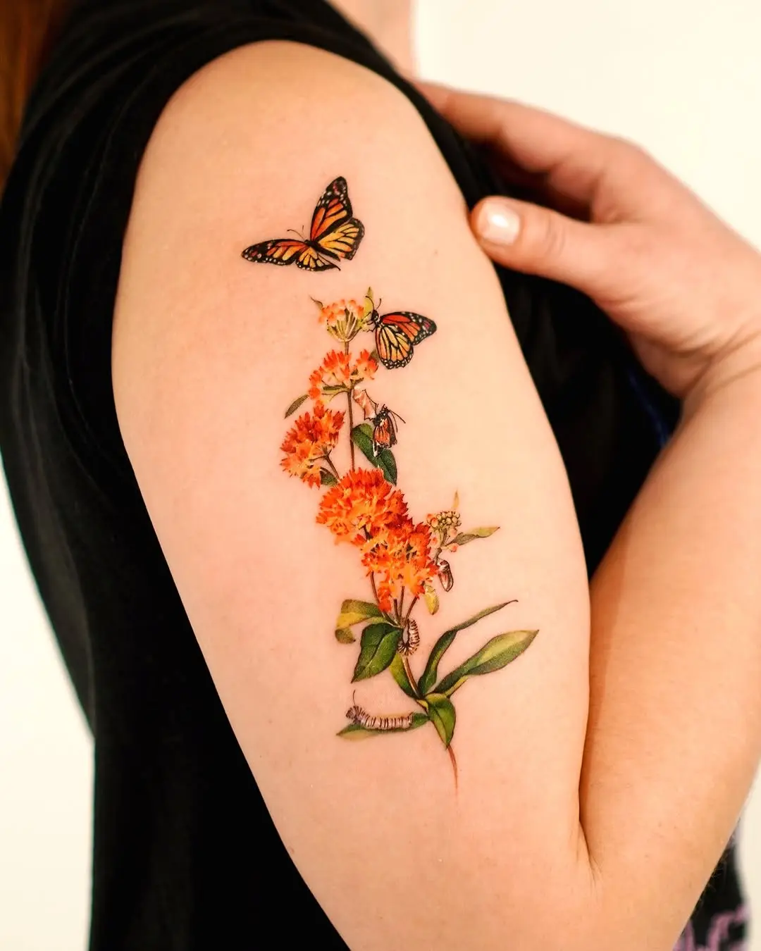 Vibrant Butterfly Tattoo With Floral Elements
