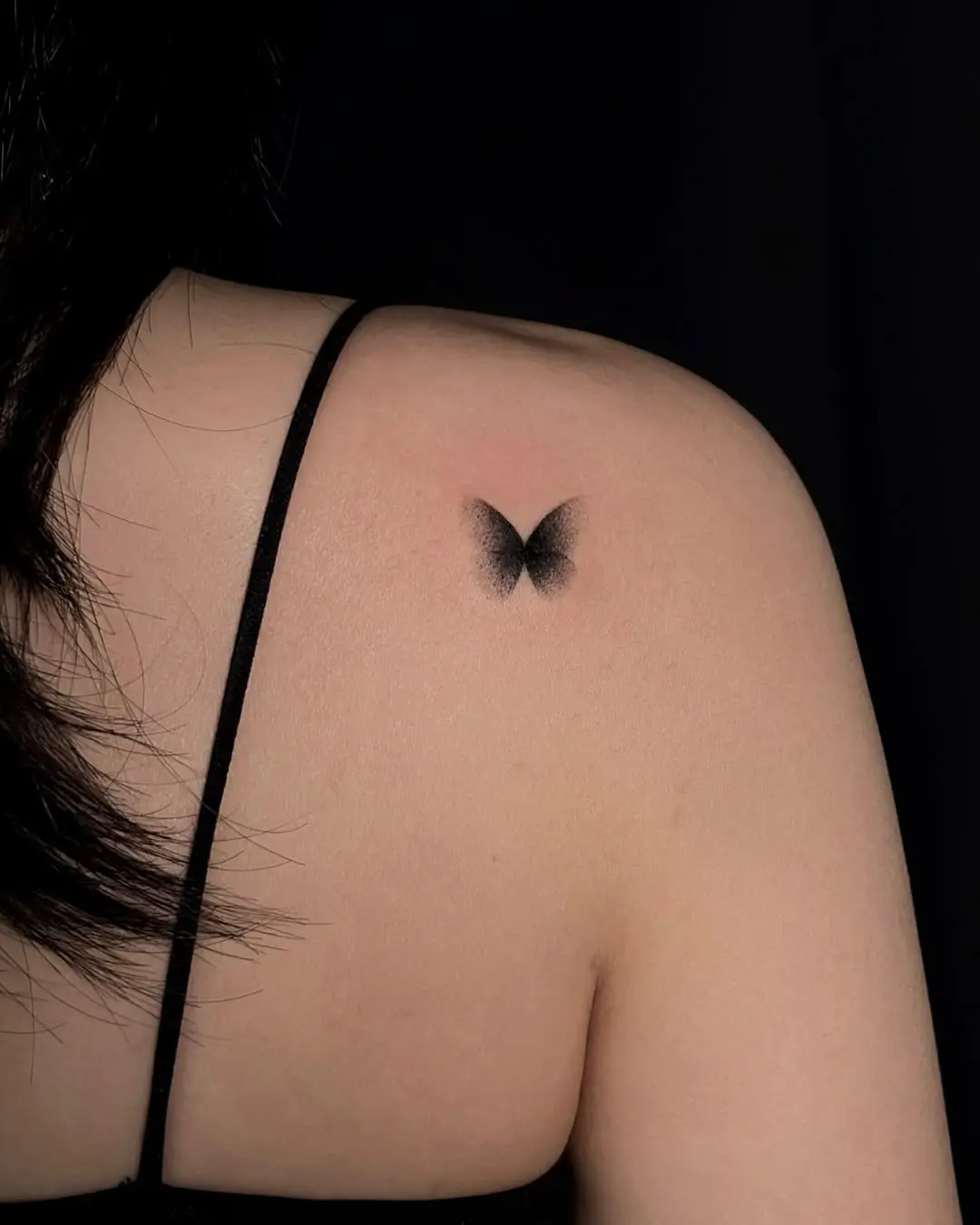 Elegant shaded butterfly tattoo on shoulder