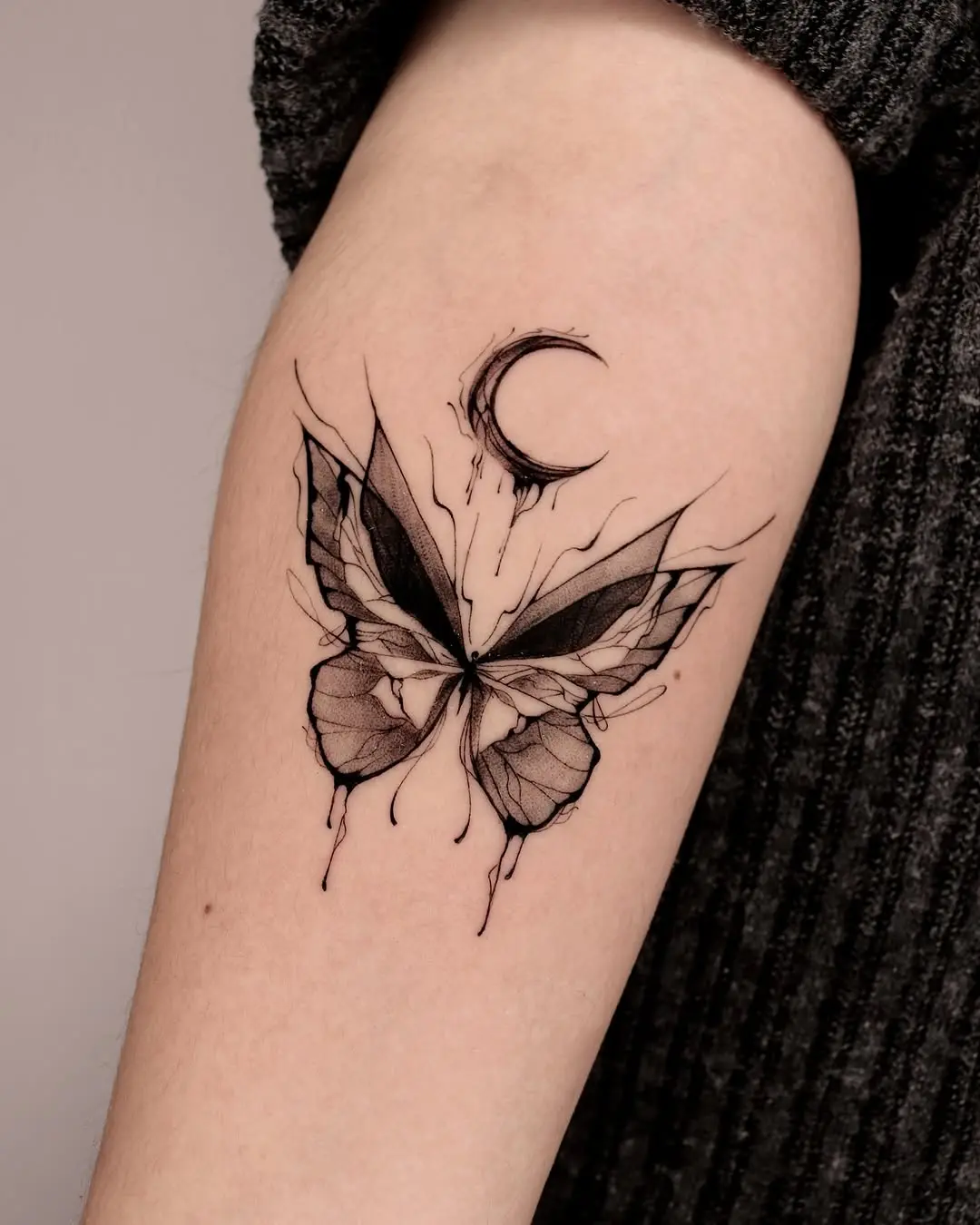Elegant butterfly tattoo with celestial elements