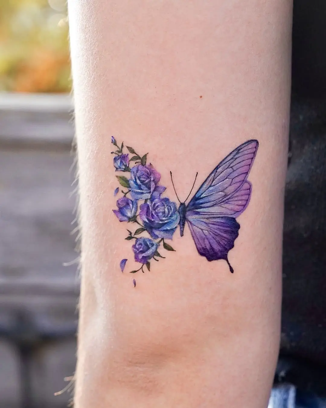 Stunning Butterfly Tattoo with Floral Accents
