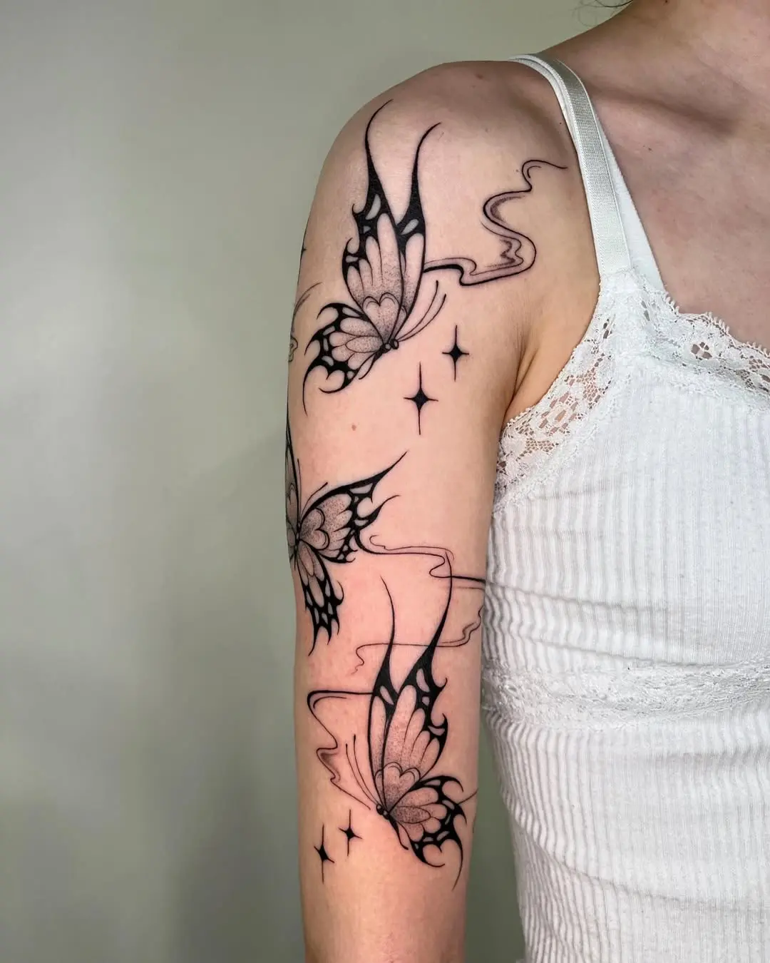 Elegant black line butterfly tattoo design