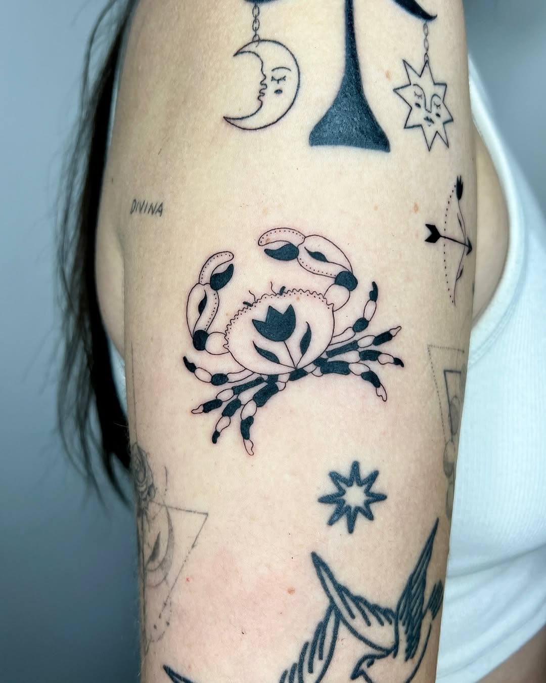 Delicate Crab Tattoo with Floral Elements