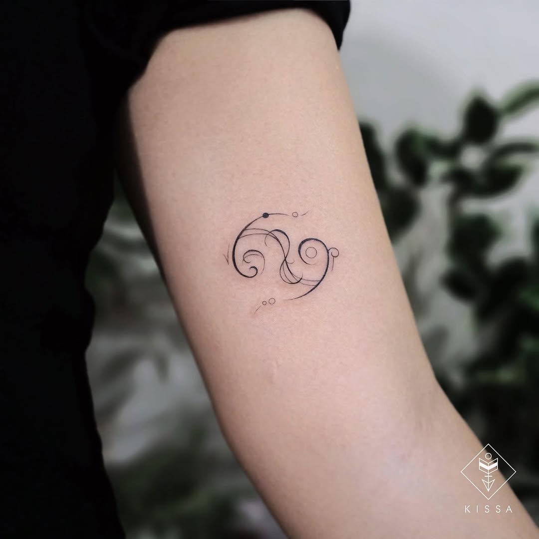 Elegant cancer zodiac tattoo design with curves