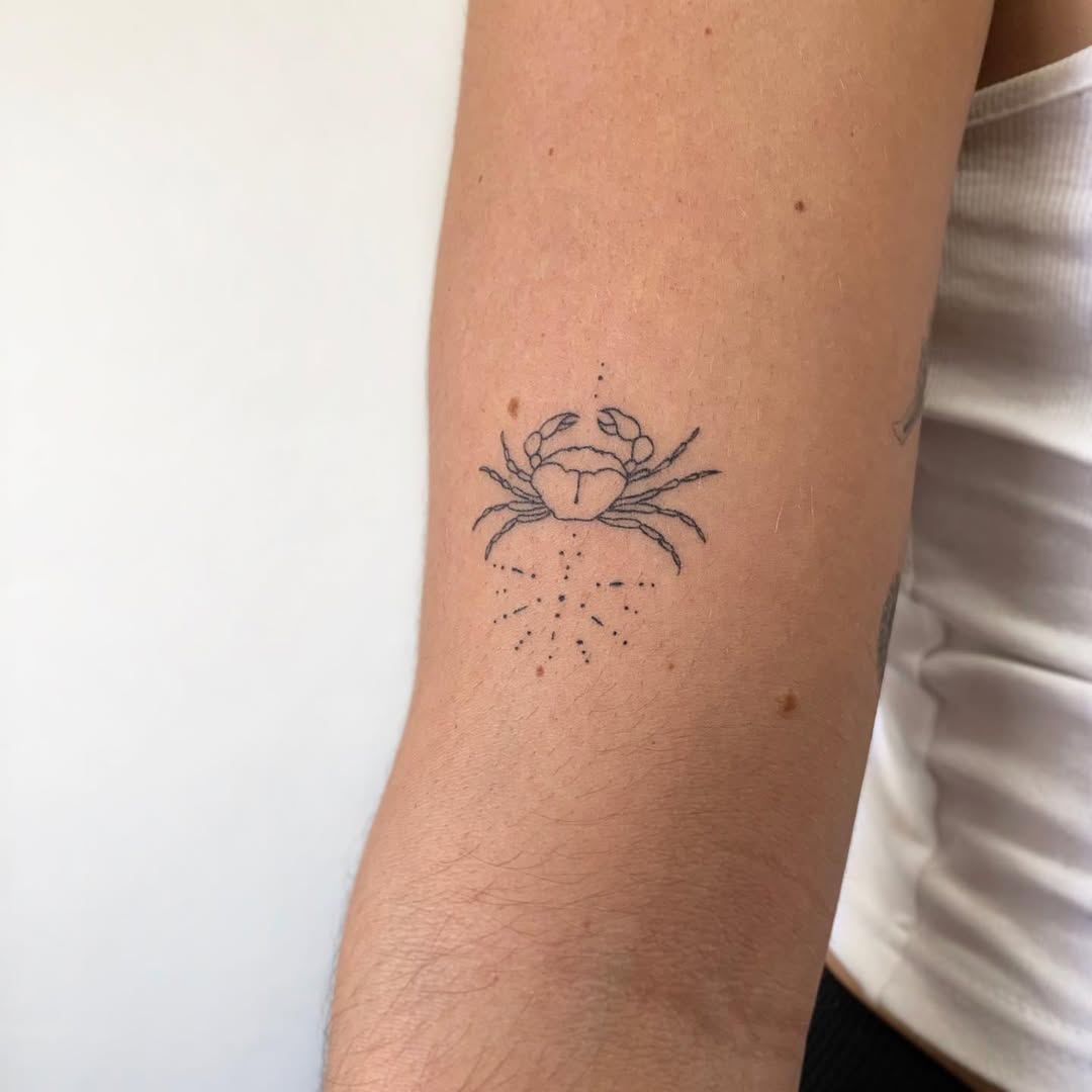 Elegant crab tattoo representing Cancer zodiac