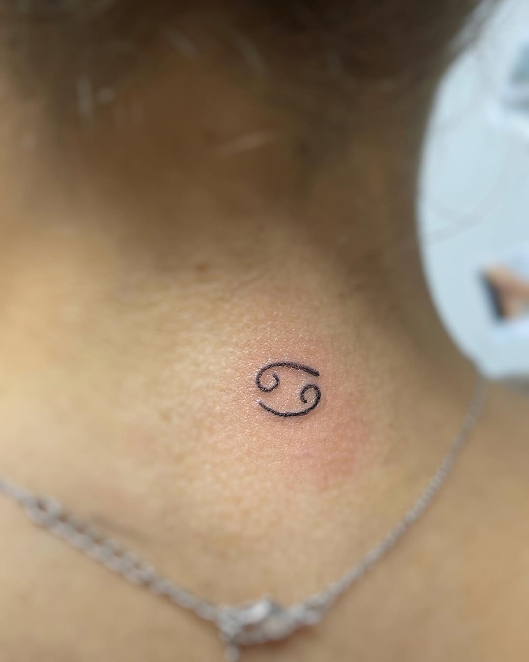 Stylish Cancer Zodiac Tattoo on the Neck