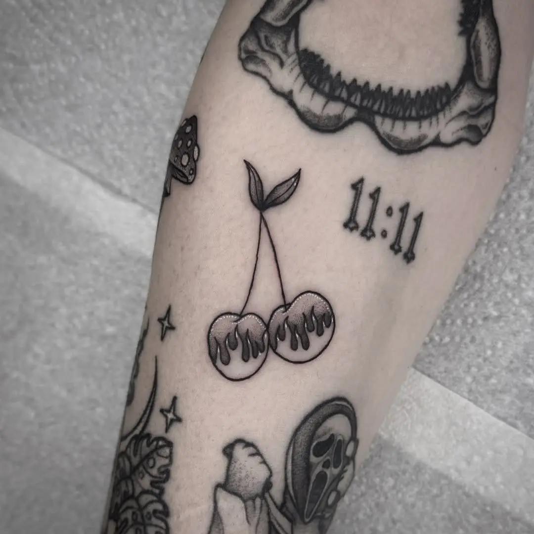 Playful cherry tattoo with a fiery twist