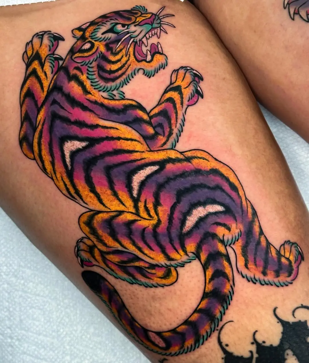 Vibrant tiger tattoo showcasing fierce artistry