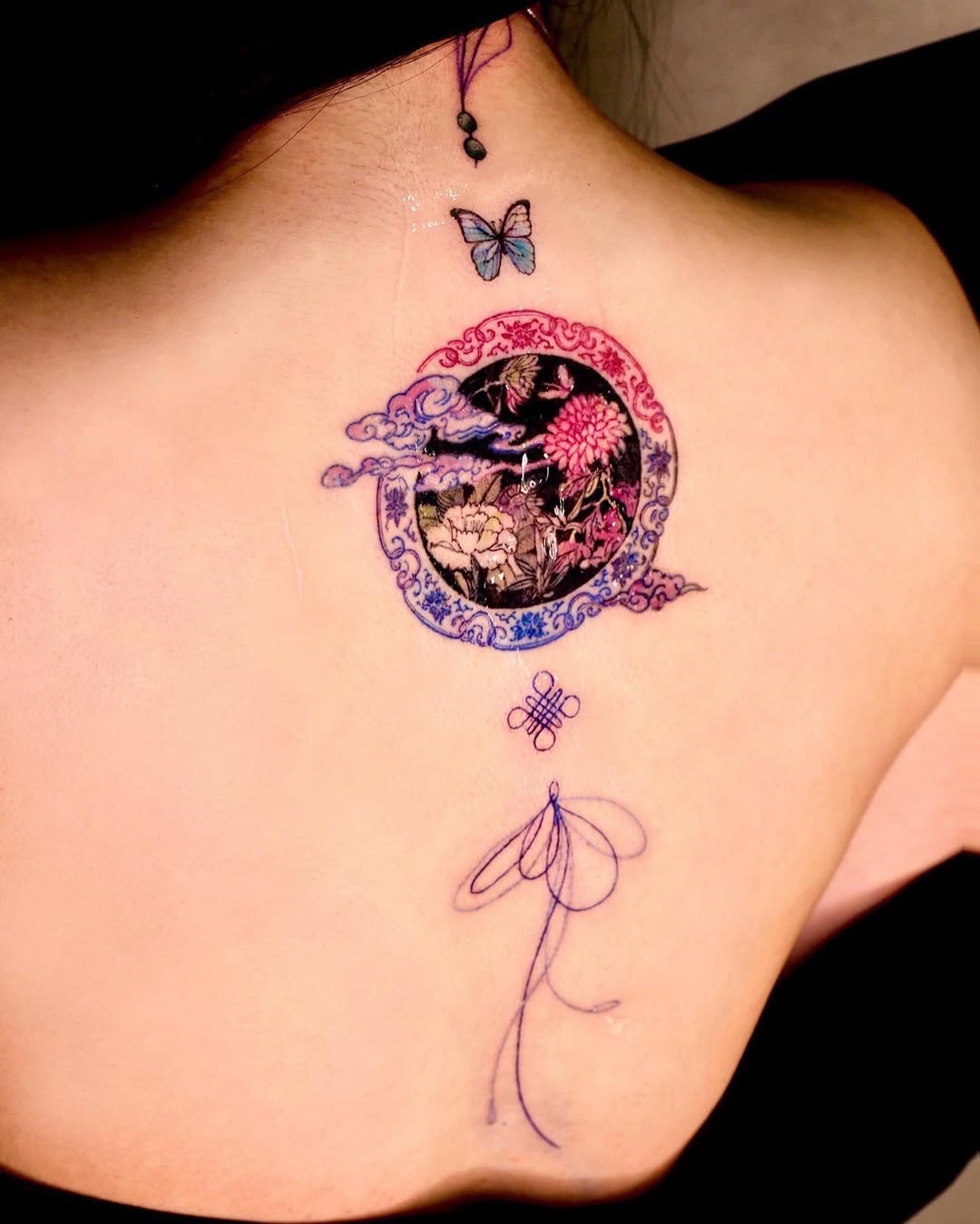 Elegant floral and butterfly back tattoo design